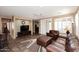 Spacious living room featuring tile floors, a ceiling fan, and plenty of natural light at 3685 N 162Nd Ln, Goodyear, AZ 85395