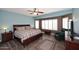 Spacious main bedroom featuring a ceiling fan, seating area, and lots of natural light at 3685 N 162Nd Ln, Goodyear, AZ 85395