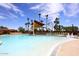 Resort-style pool with lounge chairs, shade structures, and palm trees at 3685 N 162Nd Ln, Goodyear, AZ 85395