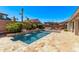 Backyard oasis featuring a refreshing pool, lush landscaping, and a barbecue, perfect for outdoor gatherings at 3851 E Vallejo Dr, Gilbert, AZ 85298