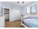 Comfortable bedroom with light blue walls and a large closet features a cozy retreat at 3851 E Vallejo Dr, Gilbert, AZ 85298