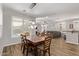 Inviting dining area with wood flooring and direct view into the living room at 3851 E Vallejo Dr, Gilbert, AZ 85298