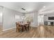 Dining room with wood table and chairs, and modern chandelier at 3851 E Vallejo Dr, Gilbert, AZ 85298