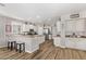 Spacious kitchen with white cabinetry, stone countertops, bar seating, and stainless steel appliances at 3851 E Vallejo Dr, Gilbert, AZ 85298