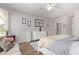 This main bedroom features neutral walls, wood floors, ceiling fan, and lots of light at 3851 E Vallejo Dr, Gilbert, AZ 85298