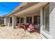 Covered patio with stone floors, ideal for relaxation and outdoor enjoyment with a comfortable seating area at 3851 E Vallejo Dr, Gilbert, AZ 85298