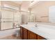 Accessible bathroom featuring grab bars, a shower with sliding glass doors, and a well-lit vanity area at 3881 S Marion Way, Chandler, AZ 85286