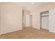 Bedroom featuring neutral walls, carpet, and a closet with sliding doors for organization at 3881 S Marion Way, Chandler, AZ 85286