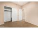 Bedroom featuring neutral walls, carpet, and a large closet with sliding doors for storage at 3881 S Marion Way, Chandler, AZ 85286