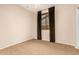 Cozy bedroom with neutral walls, carpet, and window with blackout curtains for privacy at 3881 S Marion Way, Chandler, AZ 85286