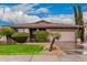 Charming single-story home featuring beautiful landscaping, a two-car garage and stone accents at 3881 S Marion Way, Chandler, AZ 85286