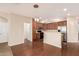 This kitchen features stainless appliances, hardwood floors, and modern pendant lighting at 3881 S Marion Way, Chandler, AZ 85286