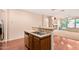 The kitchen includes a stainless steel sink, and a beautiful view into the living space at 3881 S Marion Way, Chandler, AZ 85286