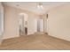 Main bedroom with neutral walls, carpet, and doors leading to bathroom and walk-in closet at 3881 S Marion Way, Chandler, AZ 85286