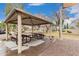 Covered picnic shelter with tables and benches for residents to enjoy outdoor dining at 3881 S Marion Way, Chandler, AZ 85286