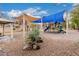 Community playground featuring slides, swings, and shaded seating areas for Gathering fun at 3881 S Marion Way, Chandler, AZ 85286