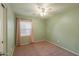 Cozy bedroom features a ceiling fan and a large window with coverings for natural light at 40401 W Hayden Dr, Maricopa, AZ 85138