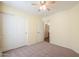 Bedroom includes closet, neutral walls, and carpet, providing a blank canvas for personalization at 40401 W Hayden Dr, Maricopa, AZ 85138