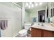 Bright bathroom featuring walk-in shower and sink vanity at 4145 W Columbine Dr, Phoenix, AZ 85029