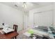 Well-lit bedroom showcasing a sewing area and closet with ceiling fan at 4145 W Columbine Dr, Phoenix, AZ 85029