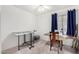 Bright bedroom featuring neutral carpet, curtains, and sewing station at 4145 W Columbine Dr, Phoenix, AZ 85029