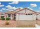 Charming single-story home featuring a tiled roof, spacious two-car garage, and low-maintenance desert landscaping at 4145 W Columbine Dr, Phoenix, AZ 85029