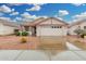 Charming single-story home featuring a tiled roof, spacious two-car garage, and low-maintenance desert landscaping at 4145 W Columbine Dr, Phoenix, AZ 85029