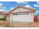 Charming single-story home featuring a tiled roof, spacious two-car garage, and low-maintenance desert landscaping at 4145 W Columbine Dr, Phoenix, AZ 85029