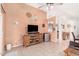 Cozy living room with tile floors, entertainment center, and neutral color palette at 4145 W Columbine Dr, Phoenix, AZ 85029