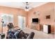 Inviting living room featuring tile flooring, natural light from sliding glass door, and comfortable seating at 4145 W Columbine Dr, Phoenix, AZ 85029