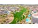 Beautiful aerial view of a golf course and residential area surrounded by lush greenery and mountains at 4319 W Winslow Way, Eloy, AZ 85131