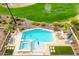 Aerial view of backyard pool, spa, lounge chairs, and manicured landscaping at 4319 W Winslow Way, Eloy, AZ 85131