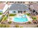 Aerial view of the backyard pool and jacuzzi, covered patio and fenced yard at 4319 W Winslow Way, Eloy, AZ 85131