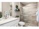 Bathroom featuring a vanity with a sink, toilet, and a glass-enclosed shower at 4319 W Winslow Way, Eloy, AZ 85131