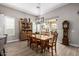 This dining room has access to the patio, a stylish hutch, and wood-look tile flooring at 4319 W Winslow Way, Eloy, AZ 85131