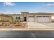 Charming single-Gathering home featuring a three-car garage and desert landscaping at 4319 W Winslow Way, Eloy, AZ 85131