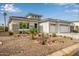 Exterior front view of a single-Gathering home showcasing desert landscaping and a three-car garage at 4319 W Winslow Way, Eloy, AZ 85131