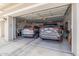 The spacious two-car garage features an automatic door, overhead lighting and has plenty of room for parking and storage solutions at 4319 W Winslow Way, Eloy, AZ 85131