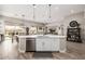 This kitchen has an island with a stainless steel dishwasher and a view of the backyard at 4319 W Winslow Way, Eloy, AZ 85131