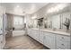 Luxurious main bathroom featuring a soaking tub, shower, and long double sink vanity with drawers at 4319 W Winslow Way, Eloy, AZ 85131