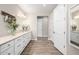 Bright and airy main bathroom with double sinks, vanity, and wood-look tile flooring at 4319 W Winslow Way, Eloy, AZ 85131