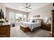 Serene main bedroom with plantation shutters overlooking a refreshing pool at 4319 W Winslow Way, Eloy, AZ 85131