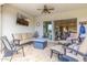 Cozy covered patio featuring a comfortable seating area and a modern outdoor ceiling fan at 4319 W Winslow Way, Eloy, AZ 85131