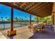 Outdoor seating area overlooking tennis courts with tables and chairs for relaxing and socializing at 4319 W Winslow Way, Eloy, AZ 85131