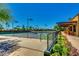 View of multiple tennis courts and shaded outdoor seating area, perfect for enjoying a match at 4319 W Winslow Way, Eloy, AZ 85131