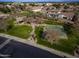 Community park featuring open green space, sports court, walking paths, and a playground at 4376 S Santiago Way, Chandler, AZ 85248