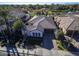 Beautiful aerial view of home showcasing the tile roof, landscaping, and three-car garage at 4376 S Santiago Way, Chandler, AZ 85248