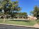 Outdoor basketball court provides a recreational space within the community, surrounded by trees and lush landscaping at 4376 S Santiago Way, Chandler, AZ 85248