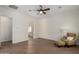 Bedroom featuring wood floors, chair, and doorway view into bath/vanity area at 4376 S Santiago Way, Chandler, AZ 85248