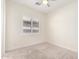 A well-lit bedroom with neutral carpet and window shutters for a comfortable ambiance at 4376 S Santiago Way, Chandler, AZ 85248